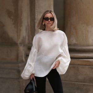 woman in white top and black pants
