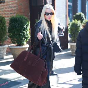 Anya Taylor-Joy in brown coat