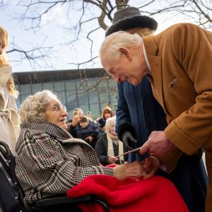 King Charles III and elderly woman