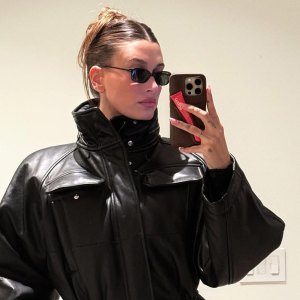Hailey Bieber Wears Fit and Flare Leather Coat Dress on Date Night With Justin