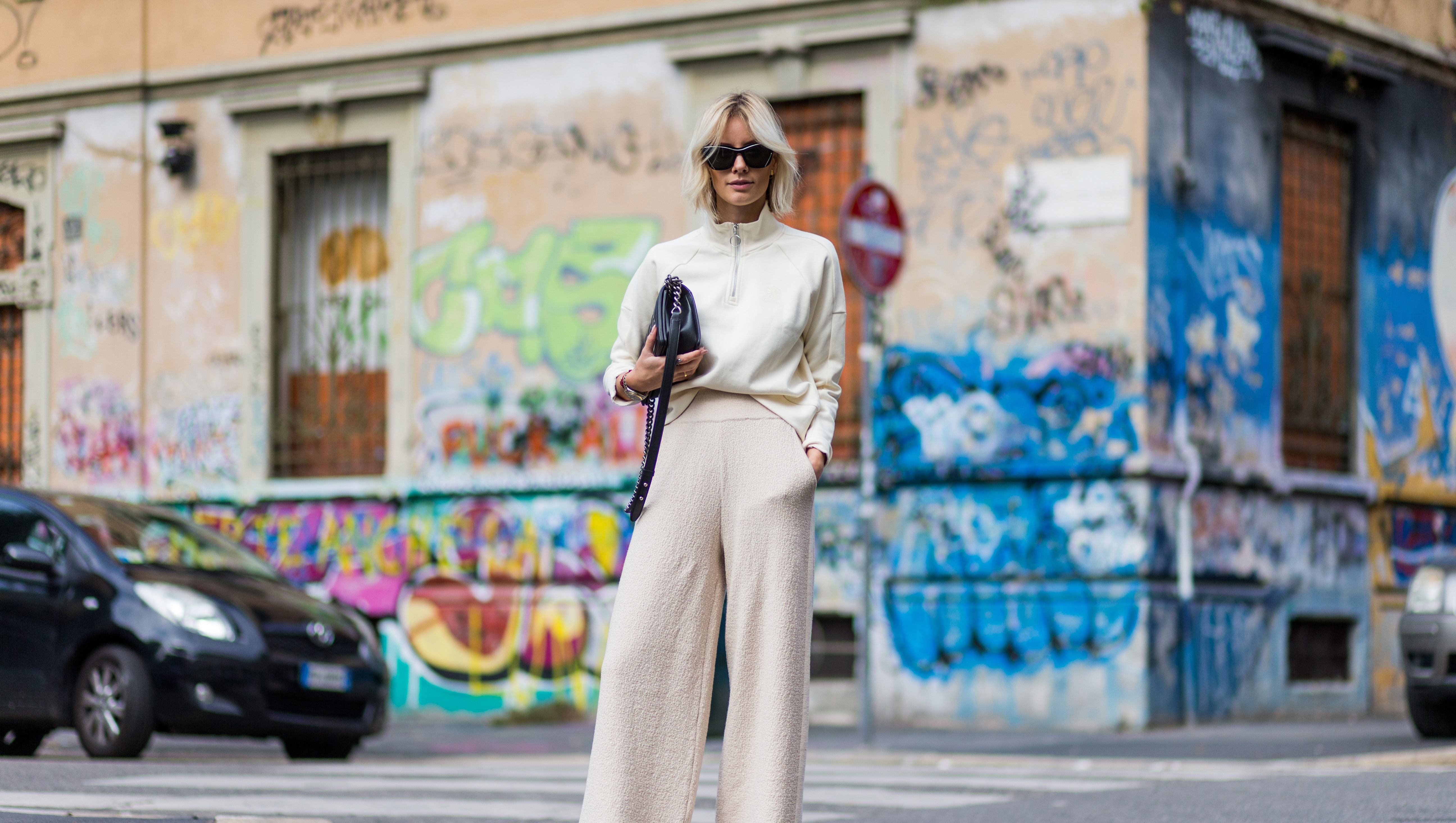 MILAN, ITALY - SEPTEMBER 22: Lisa Hahnbeuck (@lisarvd) wearing an Athleisure Look, Reebock sweater, Knit Pants Molli, sunglasses Givenchy, Adiletten, Chanel Boy Bag outside Fendi during Milan Fashion Week Spring/Summer 2017 on September 22, 2016 in Milan, Italy. (Photo by Christian Vierig/Getty Images)