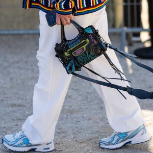 PARIS, FRANCE - MARCH 05: A guest wears Balenciaga bag outside Casablanca during the Womenswear Fall/Winter 2025/2026 as part of Paris Fashion Week on March 05, 2025 in Paris, France. (Photo by Christian Vierig/Getty Images)