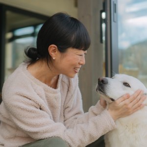 Busy pet parent loving their dog