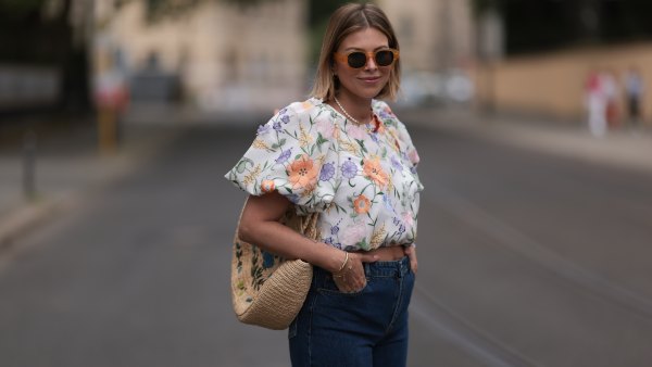 woman in floral blouse and jeans