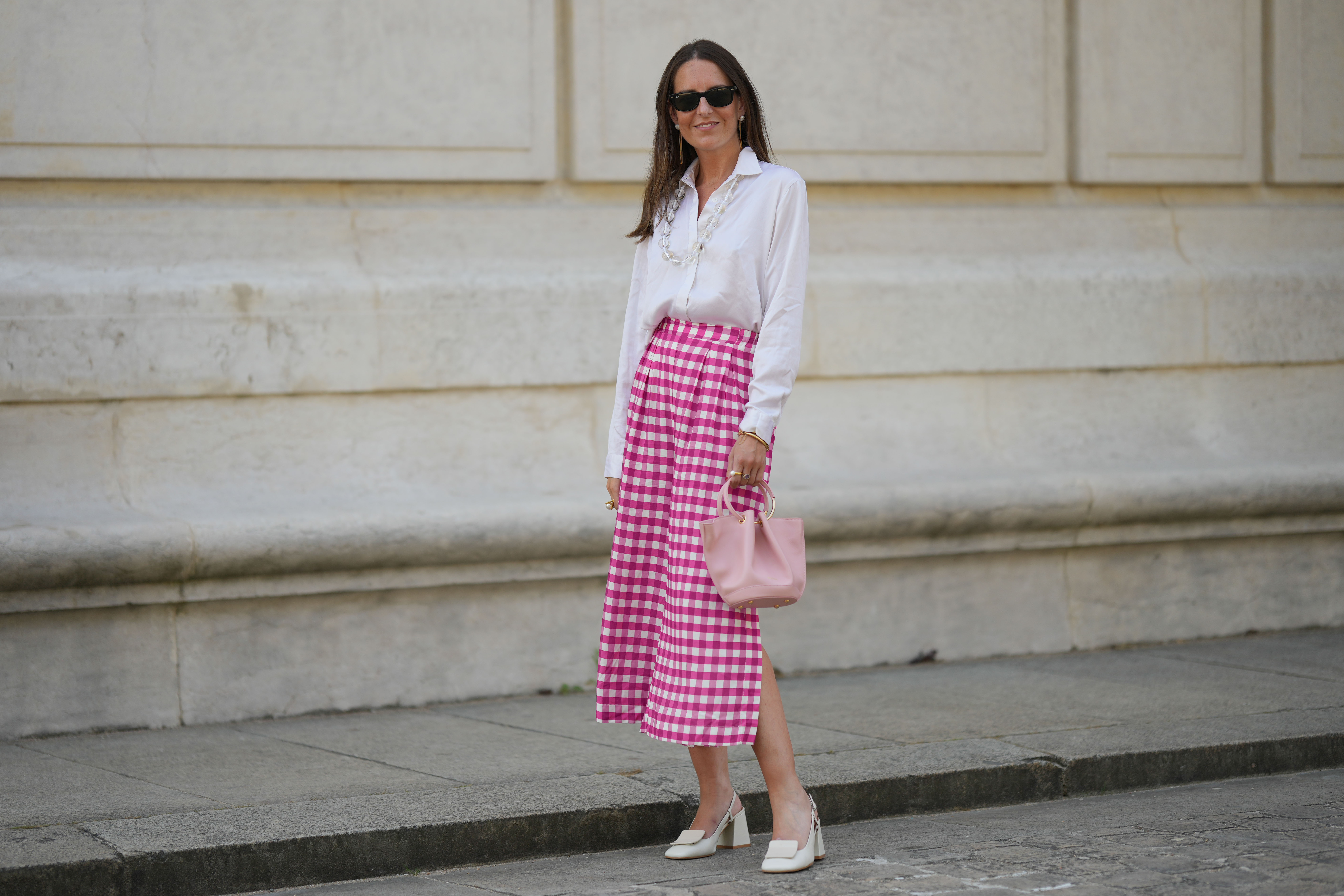 woman wearing white blouse and pink skirt
