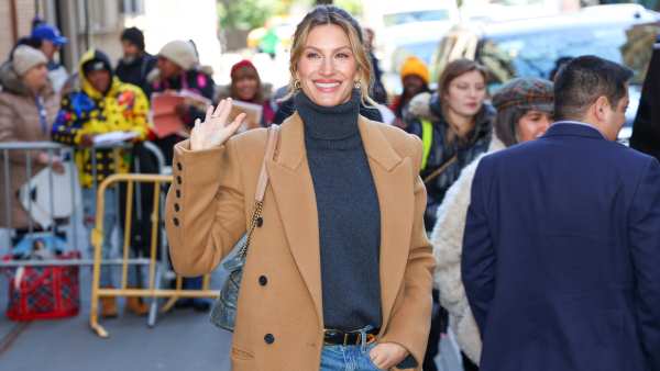 Gisele Bundchen in gray turtleneck sweater, tan trench coat and denim skirt