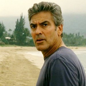 George Clooney looks back on a beach in The Descendants.
