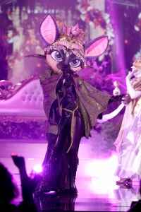 The singer's bat hidden fly away during Group B premiere and is revealed as a spoiler
