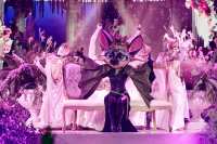 The singer's bat hidden fly away during Group B premiere and is revealed as a spoiler