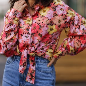 Anna Wolfers wearing colorful floral blouse and blue jeans on May 01, 2021 in Hamburg, Germany.