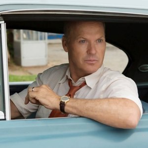 A man leans out of a car in The Founder.