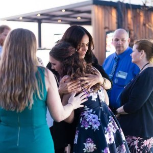 Meghan Markle hugging an unnamed women at the NYC memorial installation