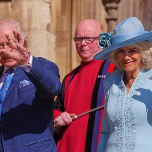 WINDSOR, ENGLAND - APRIL 20: Britain's King Charles III and Queen Camilla wave at the crowd as they arrive for the Easter Matins Service at St. George's Chapel, Windsor Castle on April 20, 2025 in Windsor, England. (Photo by Kirsty Wigglesworth - WPA Pool/Getty Images)