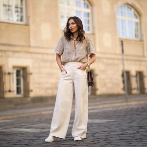 Masha Sedgwick (Maria Astor) wearing Nobi Talai blouse, Agneel bag, Closed jeans and Coach sneaker on May 06, 2020 in Berlin, Germany.