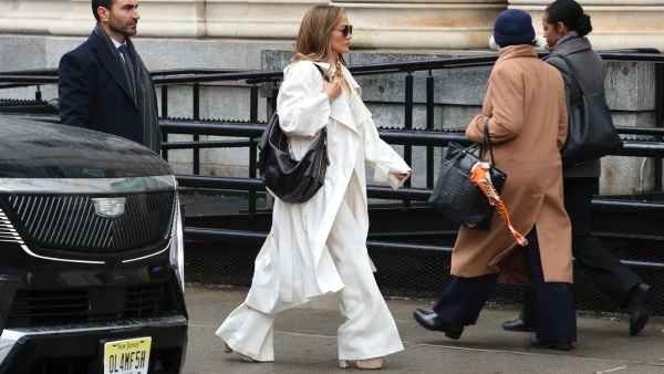 Brett Goldstein and Jennifer Lopez are seen filming on the "Office Romance" movie set on April 07, 2025 in Hoboken, New Jersey.