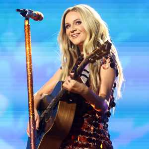 Kelsea Ballerini Accepts Bedazzed Boots From a Fan and Wears Them on Stage