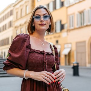 Mid-Adult Woman Standing On The Street In Florence In Italy - stock photo