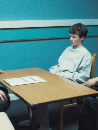 A cop interrogates a boy and his father in Adolescence.