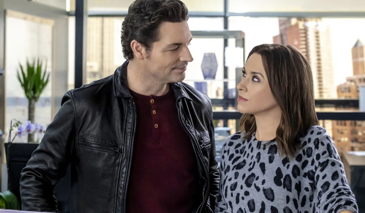 Brennan Elliott and Lacey Chabert in 'Crossword Mysteries: Riddle Me This.'