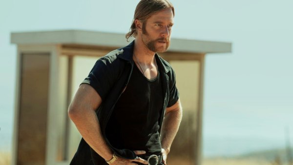 A man stares ahead in Mrs. Davis.