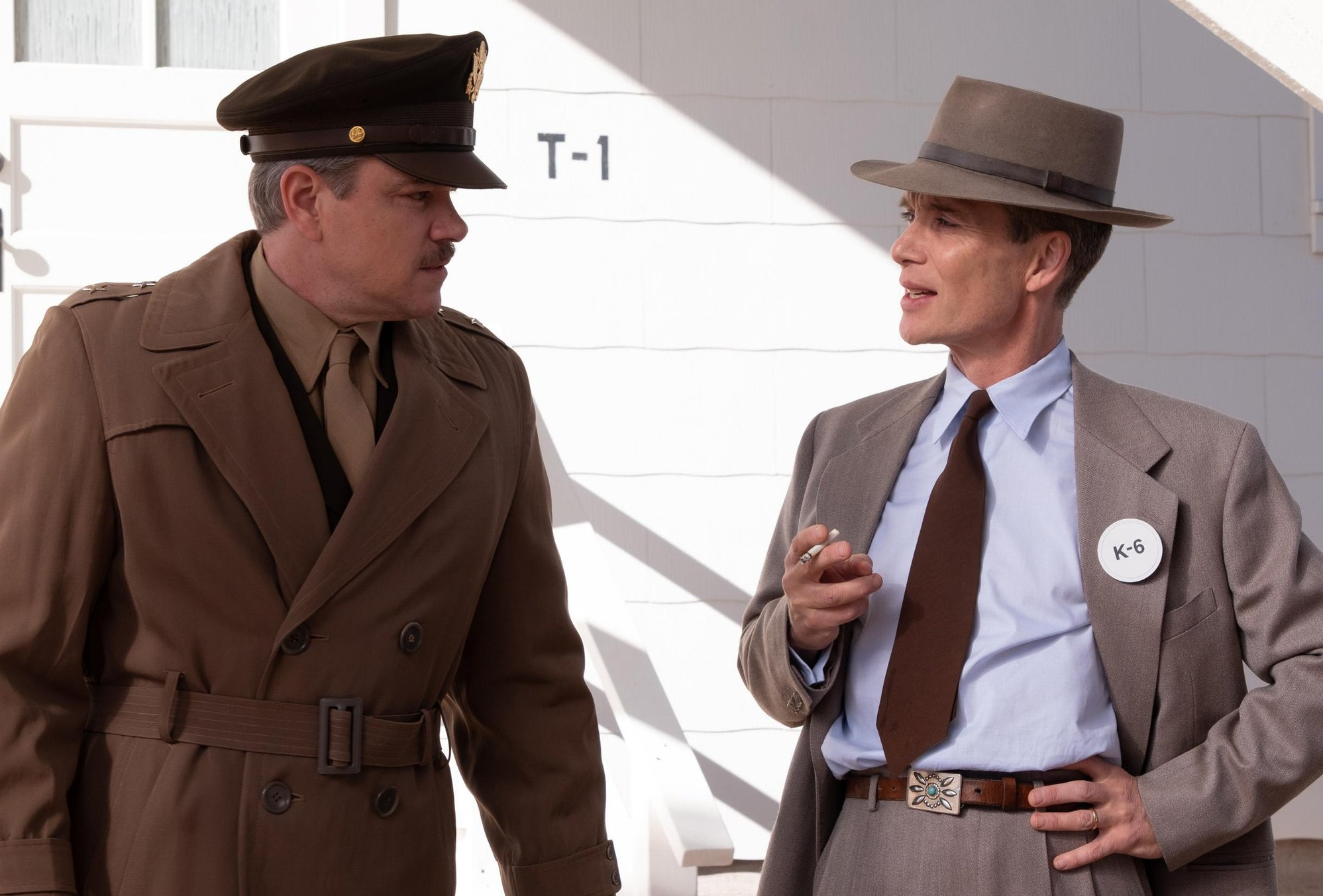 Two men talk to each other in Oppenheimer.
