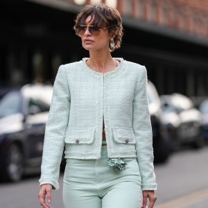 NEW YORK, NEW YORK - FEBRUARY 08: Irina Kro wears dark brown sunglasses, silver earrings, light green cropped Alice + Olivia jacket, light green loose denim jean Alice + Olivia pants, light green Ankvas leather bag, white pointed toe heels Alice + Olivia leather shoes, outside Alice + Olivia, during the New York Fashion week Fall/Winter 2025 on February 8, 2025 in New York, New York. (Photo by Edward Berthelot/Getty Images)