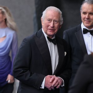 King Charles Is All Smiles in Tuxedo at Premiere Amid Mounting Prince Harry Feud
