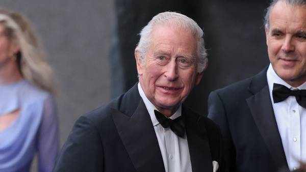 King Charles Is All Smiles in Tuxedo at Premiere Amid Mounting Prince Harry Feud