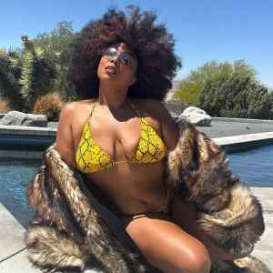 Lizzo Has Major Mom Wife Moment in Sexy Bikini and Fur Coat