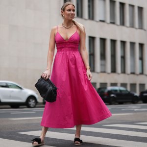 COLOGNE, GERMANY - MAY 12: Sarah Achterholt wearing pink Zara dress, black Isabel Marant pouch bag and black Manebi slides via The Wants Shoes on May 12, 2021 in Cologne, Germany. (Photo by Jeremy Moeller/Getty Images)