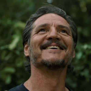 Pedro Pascal smiles in 'The Last of Us.'