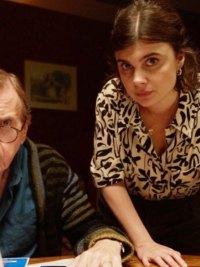 A man and a woman lean forward in 'Death Valley.'