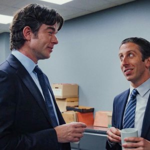 Two men talk and hold coffee in 'Poker Face' season 2.