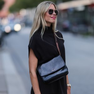 HAMBURG, GERMANY - AUGUST 15: Vanessa Gieser is seen wearing black Hermes Chypre sandals, Golden Goose small leather handbag, a SoSue black two-piece, a silver gold Rolex watch and sunglasses on August 15, 2022 in Hamburg, Germany. (Photo by Jeremy Moeller/Getty Images)