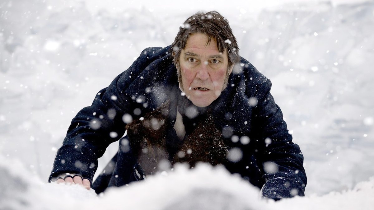 A man crawls through the snow in 'The Terror' season 1.