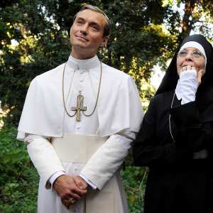A pope and a num stand in a garden in 'The Young Pope.'