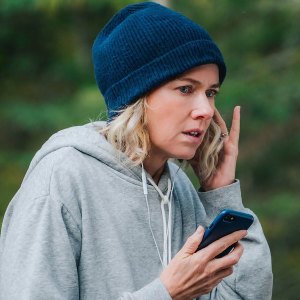 A woman listens while on her phone in 'The Desperate Hour.'