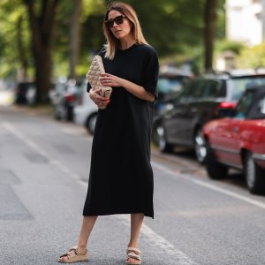 HAMBURG, GERMANY - JUNE 26: Elise Soho wearing Bruna the Label jewelry, beige Zara bag, beige Ducie London sandals and black Soho Studios midi dress on June 26, 2021 in Hamburg, Germany. (Photo by Jeremy Moeller/Getty Images)