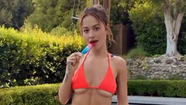 Rita Ora Shows Off Her Underboob in Neon Bikini