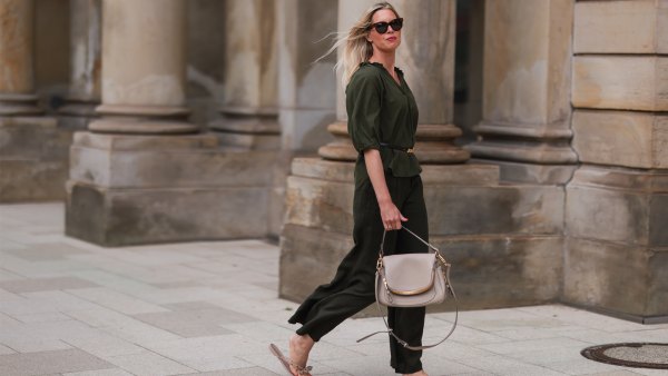 Vanessa Gieser seen wearing a brown Celine sunglasses, khaki blouse from SoSue, a matching khaki pants from SoSue, a beige leather Tom Ford bag, a black Celine belt and beige Valentino sandals on June 09, 2022 in Hamburg, Germany.