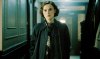 A woman walks down a hall in 'Boston Stranger.'