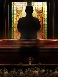 A man stands in front of a window in a funeral home in HBO's The Mortician