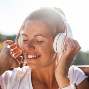 Woman wearing wireless headphones while relaxing — Amazon Prime Day headphone deals 2025