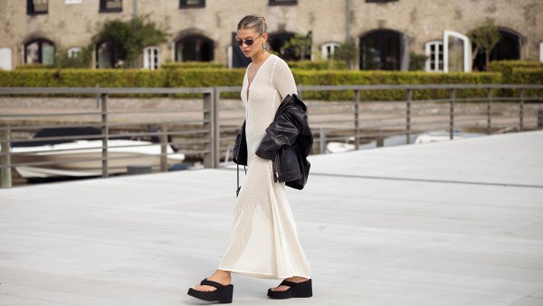COPENHAGEN, DENMARK - AUGUST 08: Sophia Geiss wears a long beige knitted maxi dress, black flip flops, sandals, leather jacket and black bag during day four of the Copenhagen Fashion Week (CPHFW) SS25 on August 08, 2024 in Copenhagen, Denmark. (Photo by Raimonda Kulikauskiene/Getty Images)