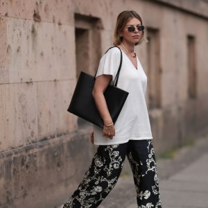 BERLIN, GERMANY - JUNE 06: Aline Kaplan wearing Zara black and white wide leg pattern pants, white Zara shirt, Marc Jacobs round silver shades and Agneel black leather bag on June 06, 2023 in Berlin, Germany. (Photo by Jeremy Moeller/Getty Images)