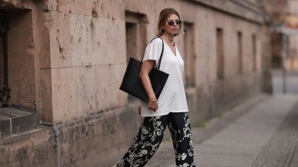 BERLIN, GERMANY - JUNE 06: Aline Kaplan wearing Zara black and white wide leg pattern pants, white Zara shirt, Marc Jacobs round silver shades and Agneel black leather bag on June 06, 2023 in Berlin, Germany. (Photo by Jeremy Moeller/Getty Images)