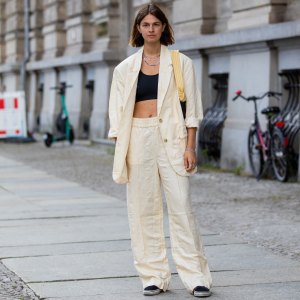 BERLIN, GERMANY - AUGUST 02: Jacqueline Zelwis is seen wearing H&M pants in beige, H&M Blazer, Understatement Bustier HVISK bag, Vans Sneakers on August 02, 2021 in Berlin, Germany. (Photo by Christian Vierig/Getty Images)