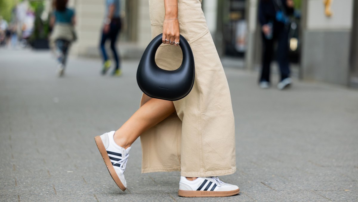 BERLIN, GERMANY - MAY 05: Jacqueline Zelwis wears sleevelss white 7forallmankind top, beige Herskind skirt, white Adidas sneakers, black Charles & Keith bag on May 05, 2024 in Berlin, Germany. (Photo by Christian Vierig/Getty Images)