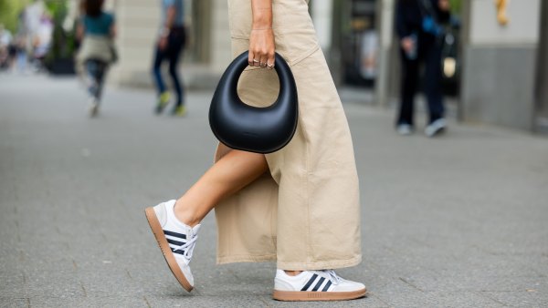BERLIN, GERMANY - MAY 05: Jacqueline Zelwis wears sleevelss white 7forallmankind top, beige Herskind skirt, white Adidas sneakers, black Charles & Keith bag on May 05, 2024 in Berlin, Germany. (Photo by Christian Vierig/Getty Images)