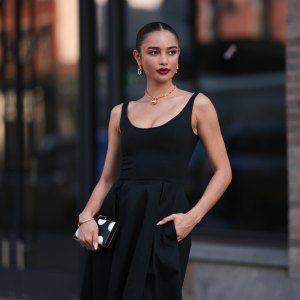 NEW YORK, NEW YORK - SEPTEMBER 12: Sara Sampaio is seen wearing yellow-gold earrings a necklace from Tiffany & Co., HardWear Collection; a sleeveless, round-necked, black midi dress; a silver bracelet; a black clutch with white polka dots before the Carolina Herrera Spring Summer 2024 Runway Show on September 12, 2023 in New York City. (Photo by Jeremy Moeller/Getty Images)